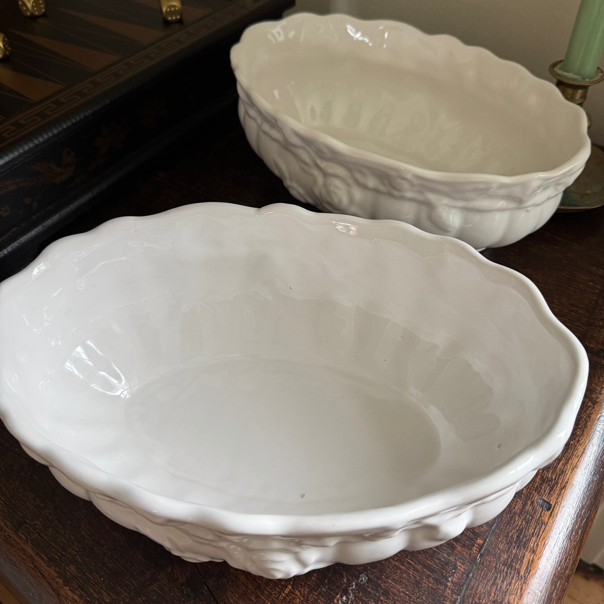 Two white ceramic bowls on a wooden surface